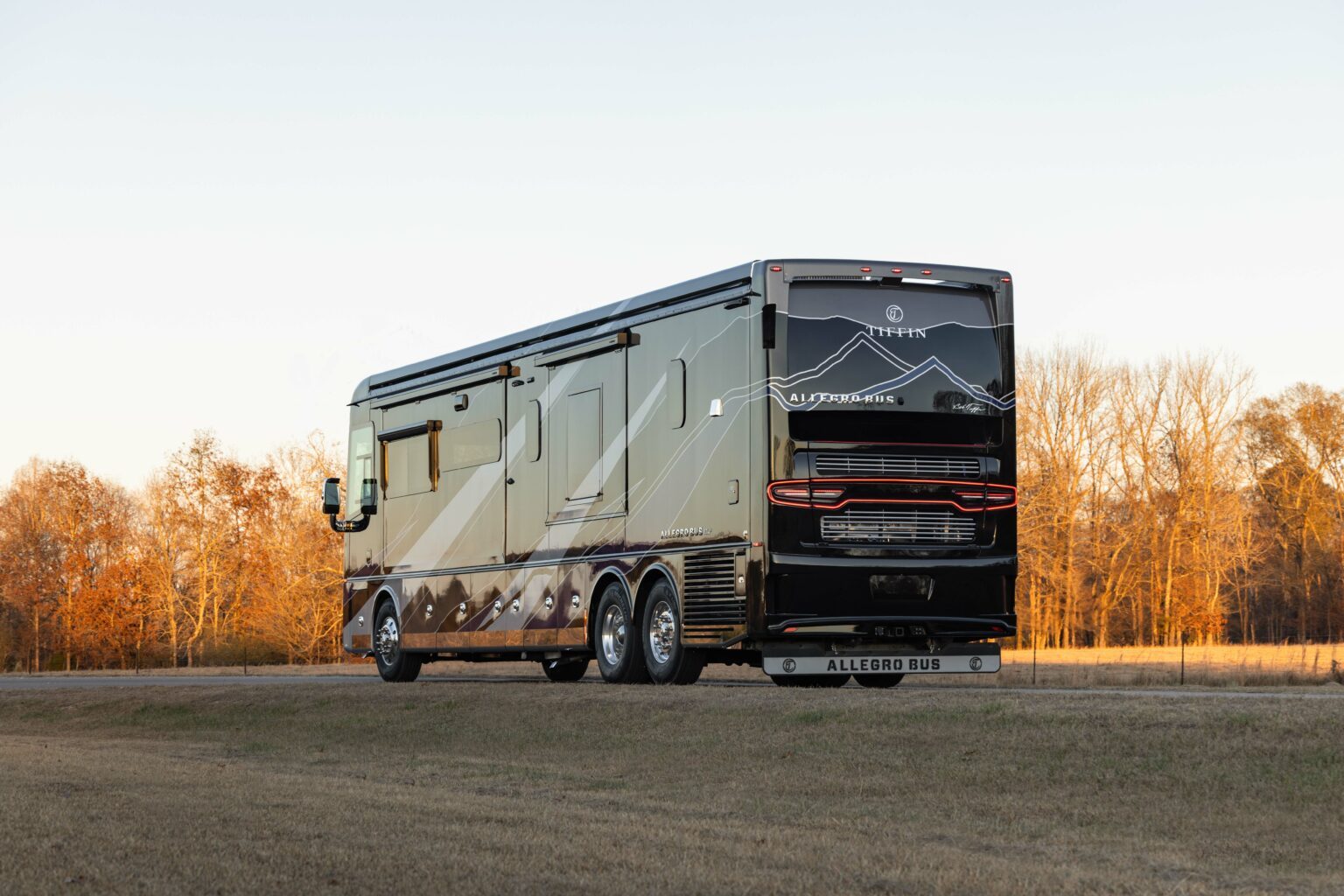 Tiffin Allegro Bus style luxury Class A diesel motorhome parked at a resort overlook