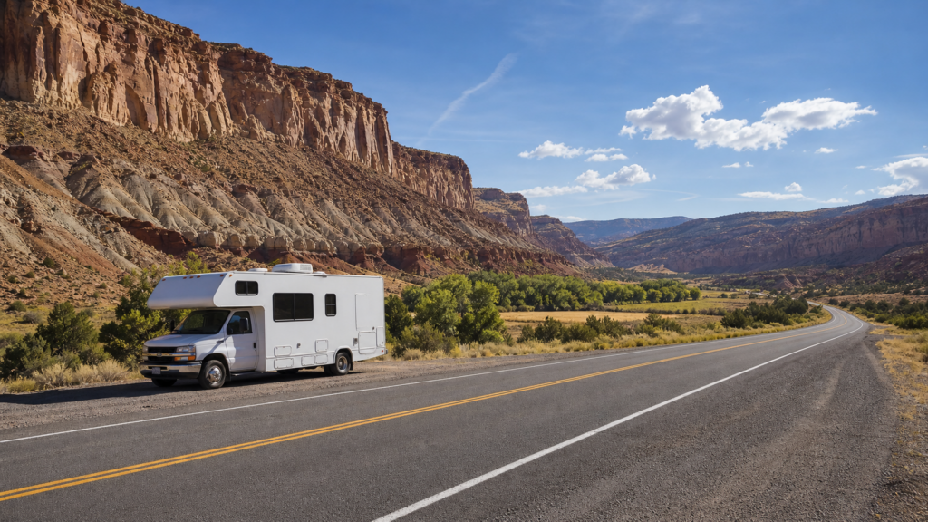 RV on a paved highway through Capitol Reef red rock country for a Capitol Reef RV route planner